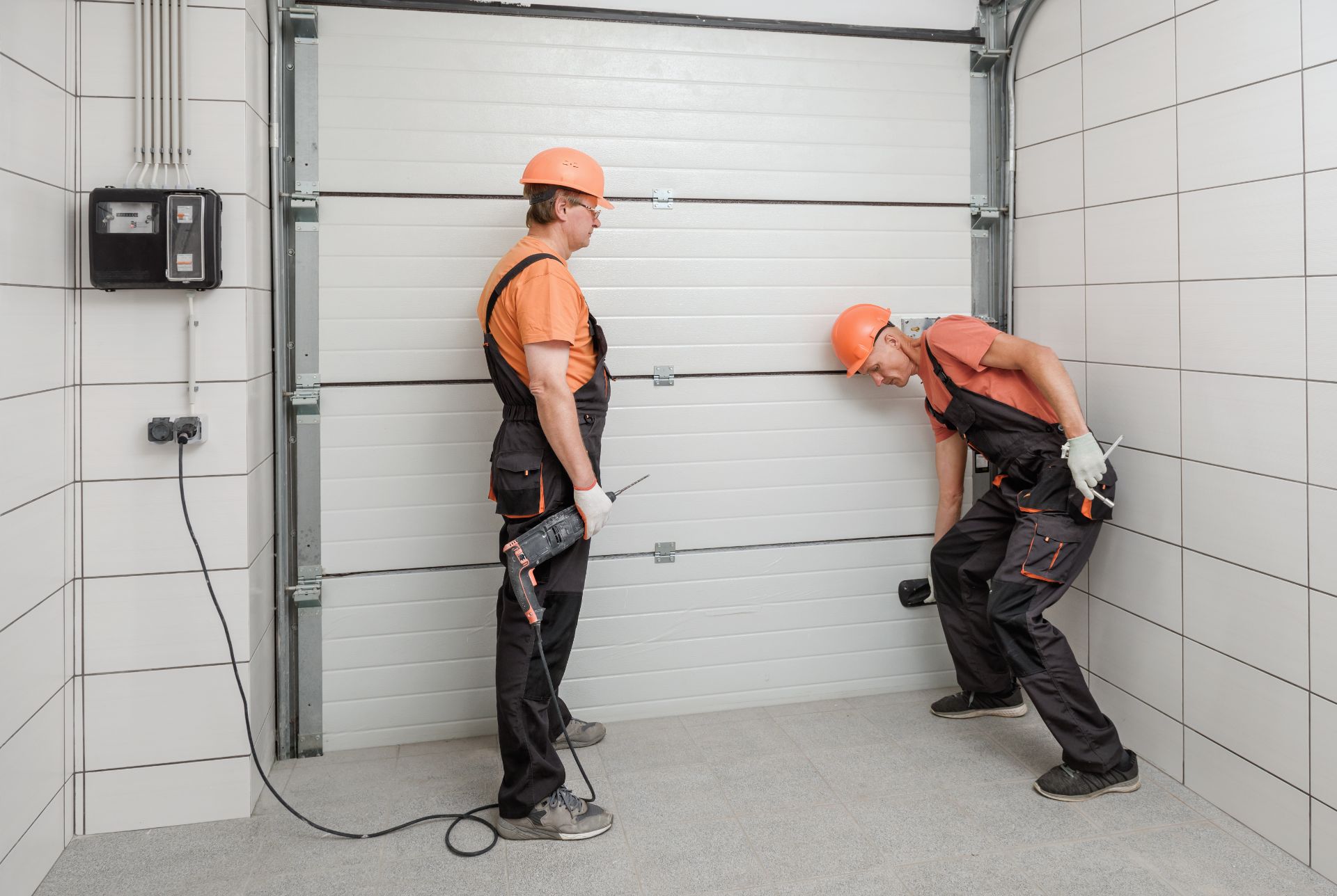 workers-are-installing-lift-gates-garage
